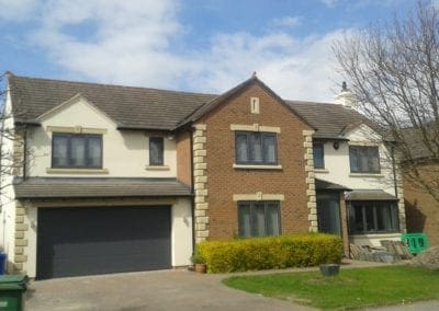 completed Clay brick home with brick edgers and rendered concrete color rendering side walls