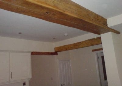 Detailed decorative ceiling beam and rendered walls